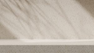 Neutral mosaic tile wall and bench creating a calm, minimalist interior atmosphere